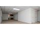 Spacious basement area with tiled ceiling, closet and partial kitchen at 6026 Belle Meade Ct, Villa Rica, GA 30180