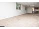 Finished basement features a tiled ceiling, window, and kitchenette area at 6026 Belle Meade Ct, Villa Rica, GA 30180