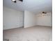 Spacious bedroom with neutral carpet, two ceiling fans, and a closet with sliding doors at 6026 Belle Meade Ct, Villa Rica, GA 30180