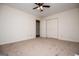 Large carpeted bedroom featuring a ceiling fan and closet at 6026 Belle Meade Ct, Villa Rica, GA 30180
