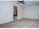 Bright bedroom with neutral carpet and an open door leading to a bathroom featuring a bathtub at 6026 Belle Meade Ct, Villa Rica, GA 30180