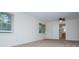 Bright bedroom featuring neutral carpet, windows, and a view to a bathroom with a wooden vanity at 6026 Belle Meade Ct, Villa Rica, GA 30180