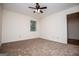 Inviting bedroom with neutral carpet, ceiling fan, and natural light at 6026 Belle Meade Ct, Villa Rica, GA 30180