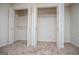 Spacious walk-in closet with open bi-fold doors and plenty of storage shelving at 6026 Belle Meade Ct, Villa Rica, GA 30180