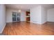 Dining area featuring laminate floors, sliding glass doors, and an adjacent kitchen at 6026 Belle Meade Ct, Villa Rica, GA 30180