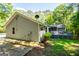 The side of the house, and the back deck with stairs, all surrounded by lush trees, makes this house very private at 6026 Belle Meade Ct, Villa Rica, GA 30180