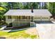 Eye-level front elevation shows a well maintained lawn, garage and covered porch at 6026 Belle Meade Ct, Villa Rica, GA 30180
