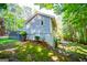 Rear exterior view of home highlighting the yard and a multi-level deck at 6026 Belle Meade Ct, Villa Rica, GA 30180