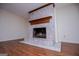 Marble fireplace with a wooden mantle and hearth adding charm to the space at 6026 Belle Meade Ct, Villa Rica, GA 30180
