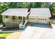 Charming single-Gathering home with a welcoming front porch and a two-car garage, surrounded by nature at 6026 Belle Meade Ct, Villa Rica, GA 30180