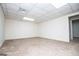 Spacious living room has neutral carpeting and white walls at 6026 Belle Meade Ct, Villa Rica, GA 30180