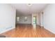 Spacious living room with gleaming hardwood floors and ample natural light from large windows at 6026 Belle Meade Ct, Villa Rica, GA 30180