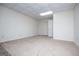 A view of the living room with neutral walls and carpeting at 6026 Belle Meade Ct, Villa Rica, GA 30180