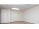 Spacious living room has white walls, closets and neutral carpeting at 6026 Belle Meade Ct, Villa Rica, GA 30180
