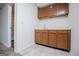 Updated wet bar features cabinetry and vinyl flooring at 6026 Belle Meade Ct, Villa Rica, GA 30180