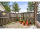 Fenced backyard with small patio area perfect for gardening or outdoor activities at 3206 Abbott Dr # 12, Powder Springs, GA 30127