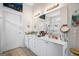 Bathroom with double sink vanity, white cabinetry, and neutral decor at 3206 Abbott Dr # 12, Powder Springs, GA 30127
