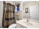Bathroom with a patterned shower curtain, a white vanity, and decorative accents at 3206 Abbott Dr # 12, Powder Springs, GA 30127