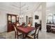 Elegant dining room with coffered ceilings, chandelier, wainscoting, and dark wood furniture at 3206 Abbott Dr # 12, Powder Springs, GA 30127