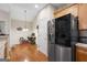 Bright kitchen with stainless steel refrigerator and wood floors at 3206 Abbott Dr # 12, Powder Springs, GA 30127