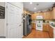 Bright kitchen features stainless steel appliances and warm wood cabinetry at 3206 Abbott Dr # 12, Powder Springs, GA 30127