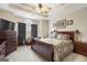 Bedroom featuring a king-size bed, dresser, side table, and tray ceiling at 3206 Abbott Dr # 12, Powder Springs, GA 30127