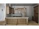 Bright kitchen with wood cabinets, marble countertops, large island, and stainless-steel appliances at Lot 1 Alex Stephens Rd # 1, Moreland, GA 30259