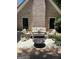 Inviting backyard patio with a comfortable seating area, fire pit, and beautifully landscaped surroundings at 4786 Carlene Sw Way # Iv, Lilburn, GA 30047