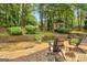 Beautiful backyard patio area with comfortable seating, a gazebo, and mature trees at 4786 Carlene Sw Way # Iv, Lilburn, GA 30047