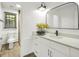 Well-lit bathroom boasts a quartz countertop vanity, large mirror, and a separate tiled shower area at 4786 Carlene Sw Way # Iv, Lilburn, GA 30047