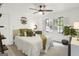 Serene bedroom featuring a queen-size bed, ceiling fan, and neutral decor for a peaceful retreat at 4786 Carlene Sw Way # Iv, Lilburn, GA 30047