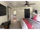 Stylish bedroom with a decorative bed, modern sliding doors, and ample natural light at 4786 Carlene Sw Way # Iv, Lilburn, GA 30047