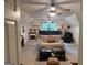 Relaxing bonus room with a comfortable sofa, fireplace, and large windows at 4786 Carlene Sw Way # Iv, Lilburn, GA 30047