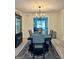 Dining room with wainscoting, designer light fixture, and decorative rug at 4786 Carlene Sw Way # Iv, Lilburn, GA 30047