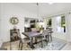 Cozy dining room with pendant lighting, gray upholstered chairs, and backyard views at 4786 Carlene Sw Way # Iv, Lilburn, GA 30047