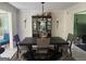 Formal dining room showcasing an elegant table setting, decorative china cabinet, and stylish lighting at 4786 Carlene Sw Way # Iv, Lilburn, GA 30047
