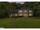 Charming two-story brick home with lush landscaping and a well-manicured lawn at 4786 Carlene Sw Way # Iv, Lilburn, GA 30047