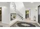 Bright foyer featuring a staircase with black iron balusters and decorative decor at 4786 Carlene Sw Way # Iv, Lilburn, GA 30047