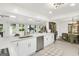 Bright open concept kitchen with large island, stainless steel appliances, and backyard view at 4786 Carlene Sw Way # Iv, Lilburn, GA 30047