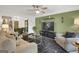 Cozy living room featuring stylish decor, neutral furniture, and a connected dining area at 4786 Carlene Sw Way # Iv, Lilburn, GA 30047