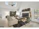 A charming living room features a cozy fireplace, vaulted ceilings with skylights, and comfortable seating at 4786 Carlene Sw Way # Iv, Lilburn, GA 30047