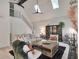 Bright living room boasts vaulted ceilings, skylights, a cozy fireplace, and stylish decor at 4786 Carlene Sw Way # Iv, Lilburn, GA 30047