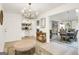 Bright living space with chandelier, decorative table, and open access to a dining area at 4786 Carlene Sw Way # Iv, Lilburn, GA 30047