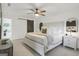 Tranquil main bedroom features a ceiling fan and access to a modern bathroom with a barn door at 4786 Carlene Sw Way # Iv, Lilburn, GA 30047