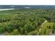 Expansive aerial view showcases a vast, tree-filled landscape, perfect for nature enthusiasts and outdoor adventures at 6605 Old White Mill Rd, Fairburn, GA 30213