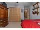 Bedroom featuring sports decor, closet, and carpet, offering a space for relaxation and organization at 6605 Old White Mill Rd, Fairburn, GA 30213