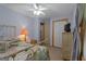 Bright bedroom featuring neutral tones, soft carpet, and a window with light-filtering curtains creating a tranquil setting at 6605 Old White Mill Rd, Fairburn, GA 30213