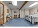 Spacious bedroom with neutral walls, cozy carpet, and an accessible attached bathroom at 6605 Old White Mill Rd, Fairburn, GA 30213