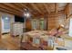 Well-appointed bedroom with attached bathroom, dresser, and wood accents at 6605 Old White Mill Rd, Fairburn, GA 30213