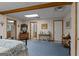 Comfortable bedroom with neutral walls, cozy carpet, and multiple doors for easy access at 6605 Old White Mill Rd, Fairburn, GA 30213
